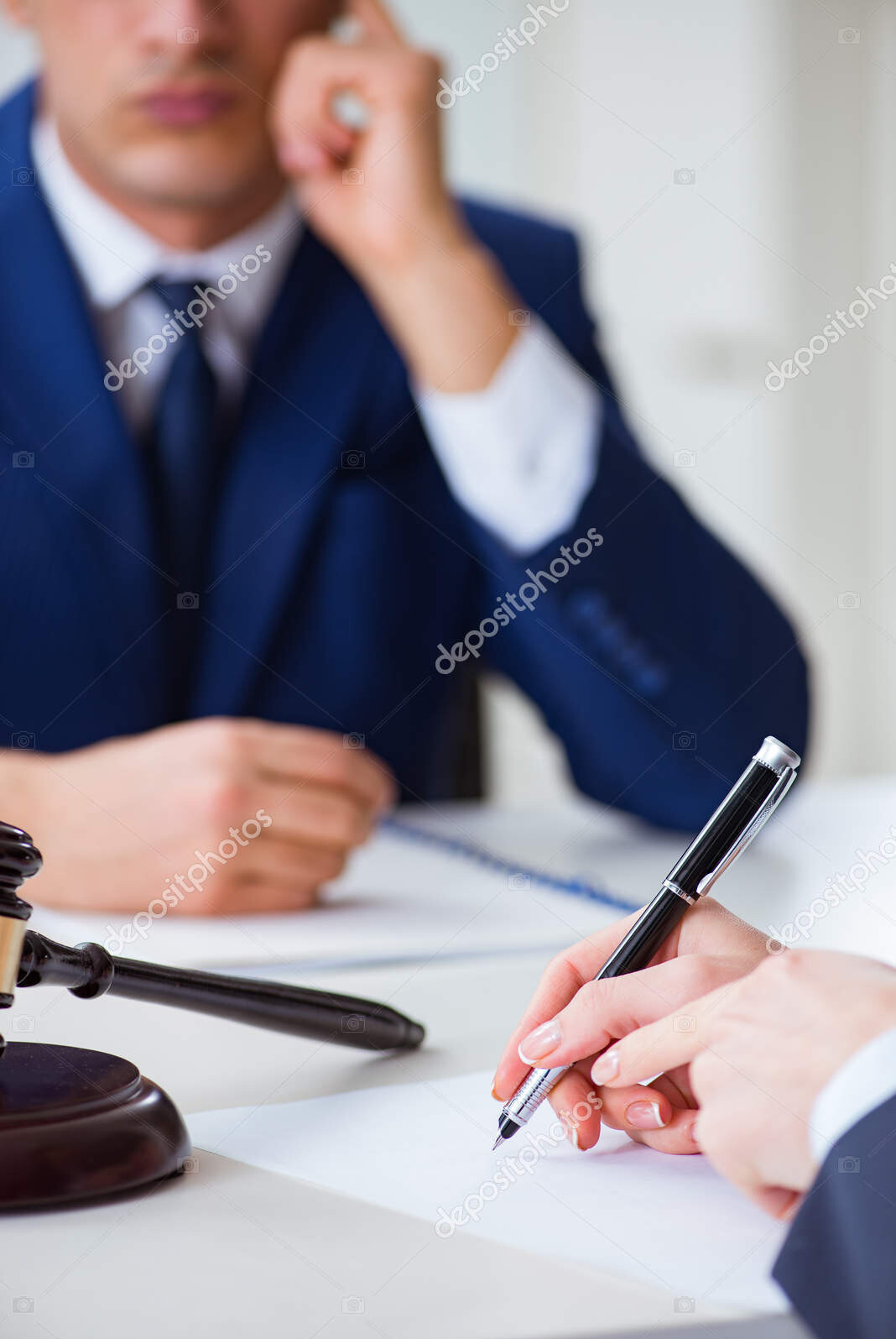 lawyer talking to his client in office