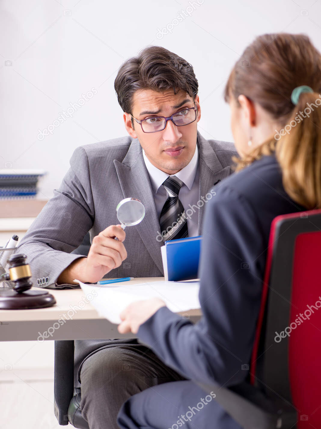 lawyer talking to client in office
