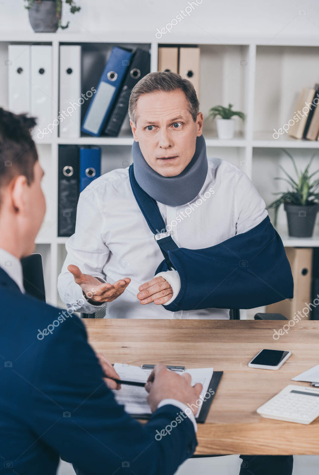 depositphotos 241376968 stock photo middle aged worker neck brace