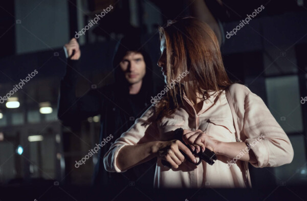 depositphotos 282075842 stock photo woman holding gun thief night