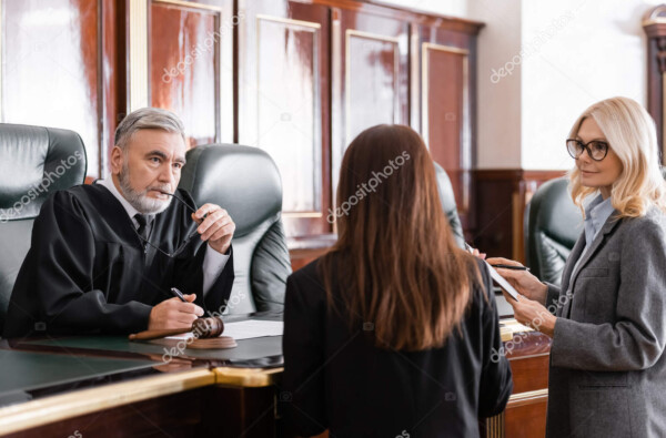 depositphotos 545925084 stock photo thoughtful judge holding eyeglasses listen