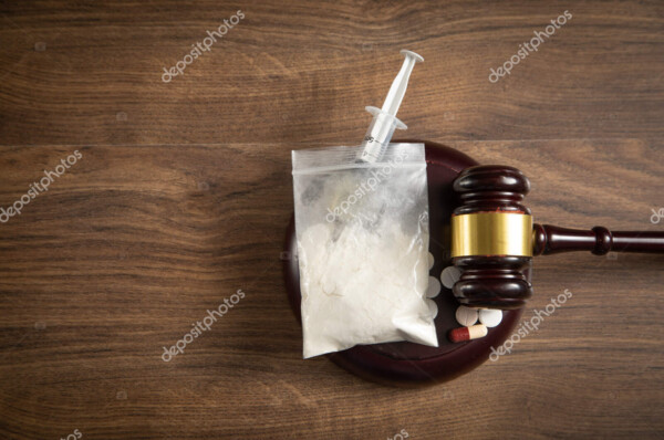 depositphotos 676271950 stock photo judge gavel syringe drugs packet